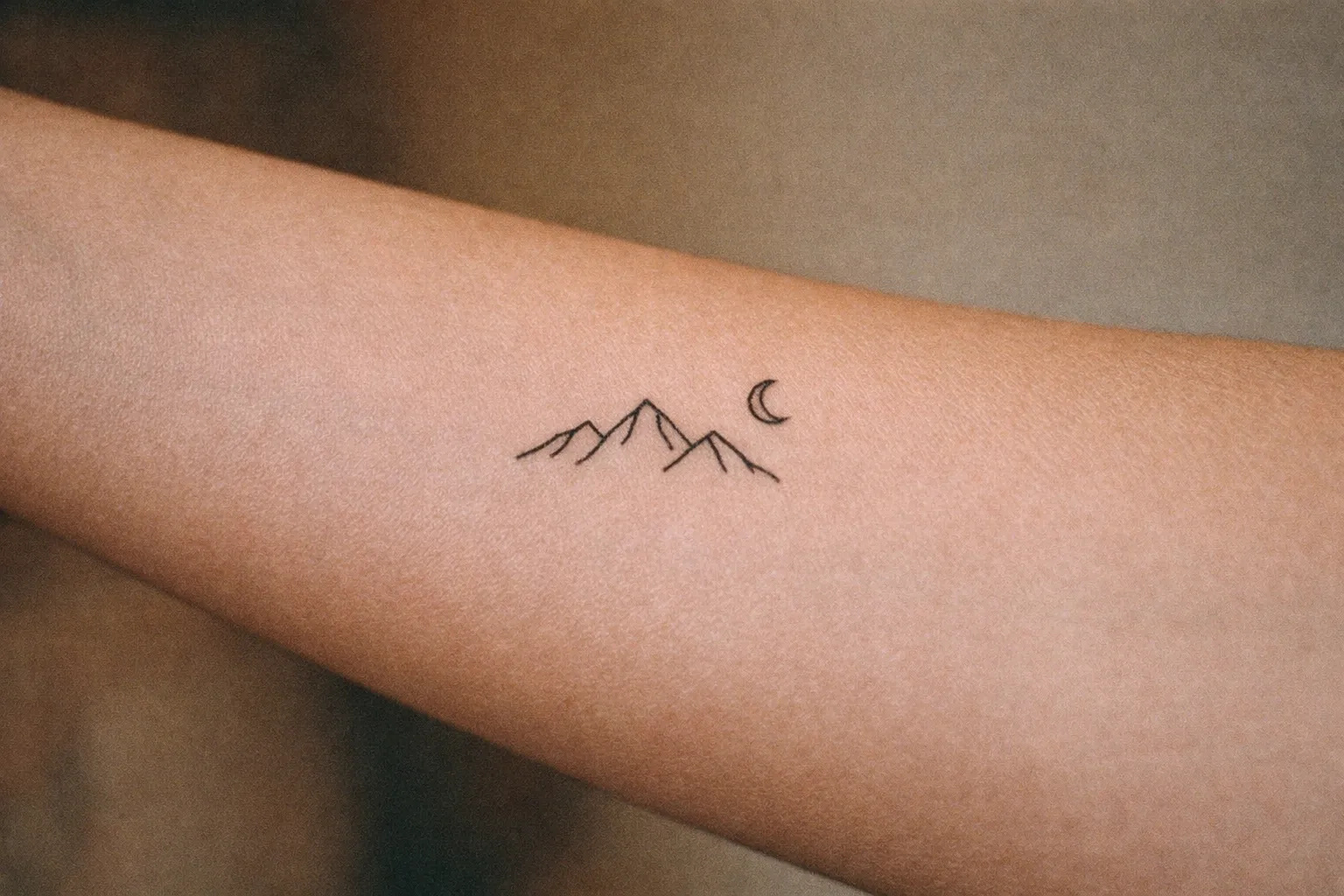 Healed tattoo on forearm demonstrating proper aftercare appearance