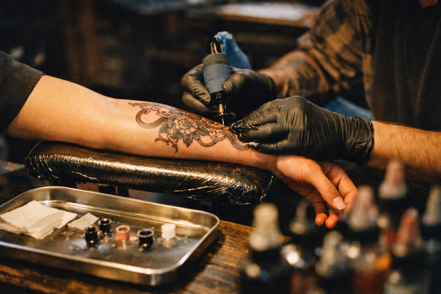 Editorial studio scene showing a tattoo session setup